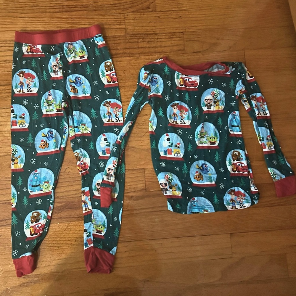 Little Sleepies Disney Pixar Christmas Pajamas with Festive Snow Globe Design